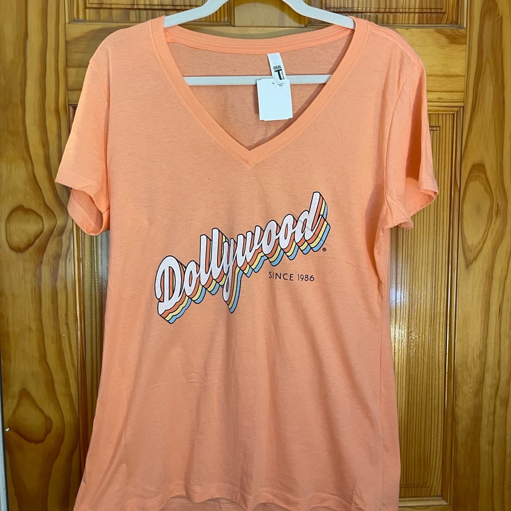 NEW WITH TAGS Light orange “Dollywood” tshirt size XXL